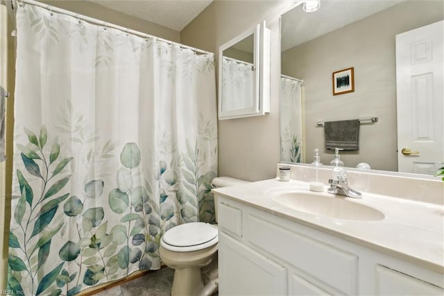 bathroom featuring vanity, toilet, and curtained shower