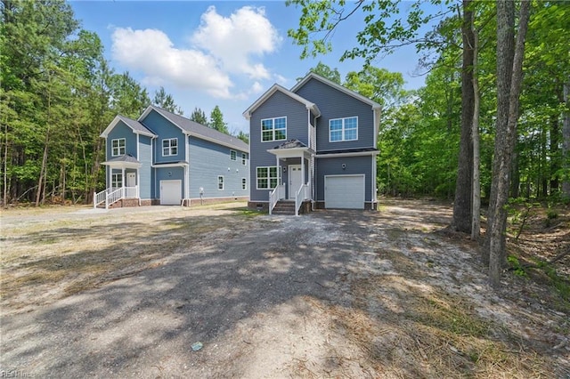 view of front of house featuring driveway and a garage