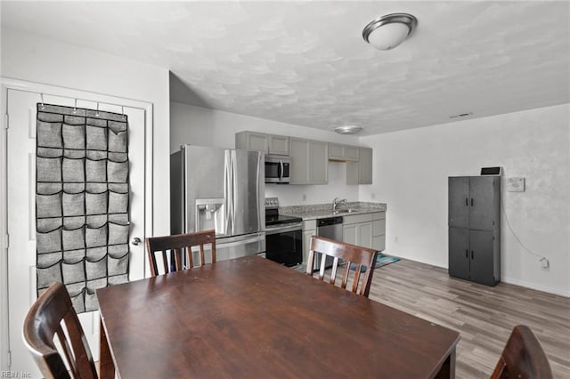 1311 24th St, Newport News, VA 23607 - dining area with baseboards, visible vents, and wood finished floors
