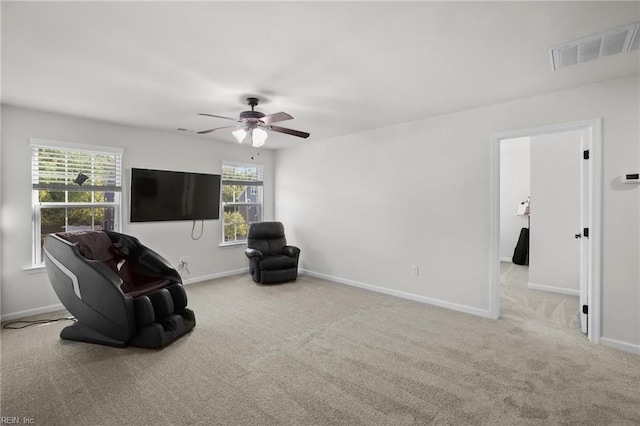 unfurnished room with a ceiling fan, baseboards, visible vents, and carpet