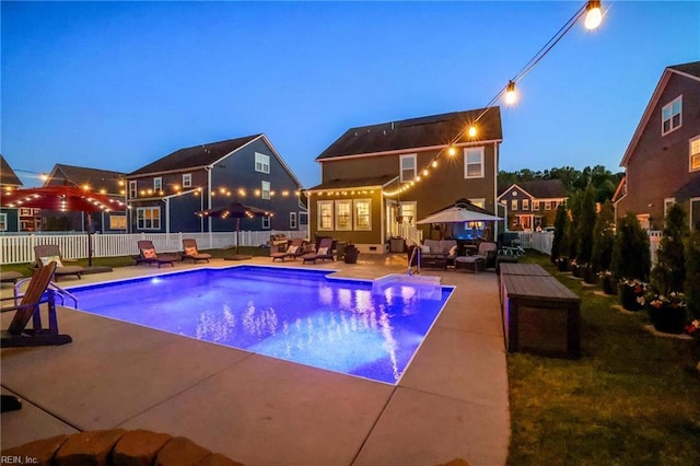 view of pool featuring a patio, a fenced backyard, outdoor lounge area, and a fenced in pool