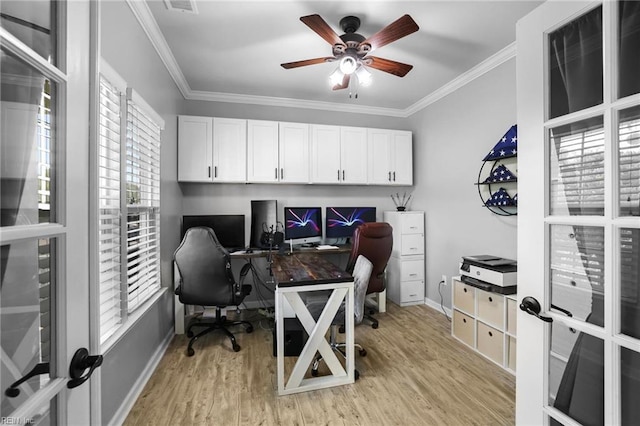 office space with crown molding, baseboards, ceiling fan, and light wood finished floors