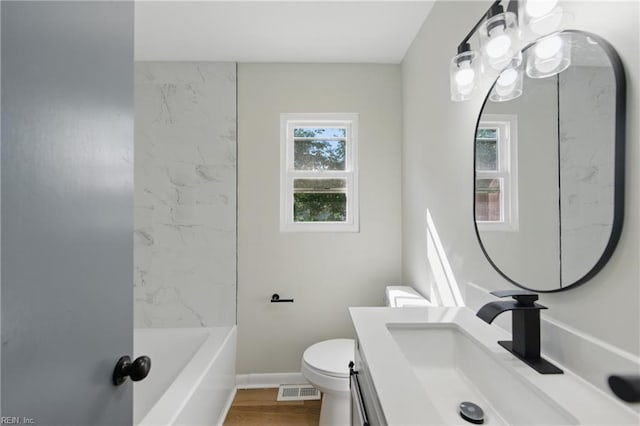 full bathroom featuring vanity, toilet, wood finished floors, and visible vents