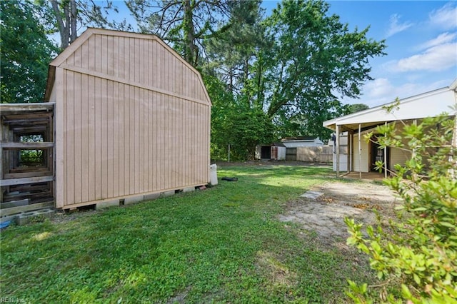 view of yard with a storage shed and an outdoor structure
