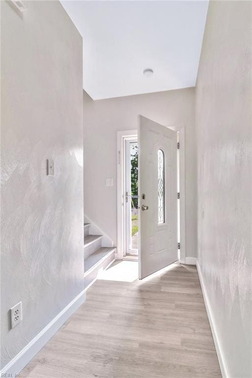2100 Ruth St, Chesapeake, VA 23324 - entryway with light wood-style flooring, stairs, and baseboards