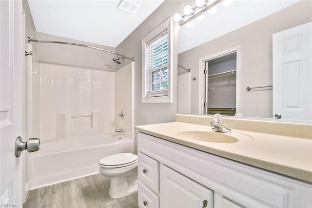 2100 Ruth St, Chesapeake, VA 23324 - full bathroom featuring vanity, toilet, shower / washtub combination, and wood finished floors