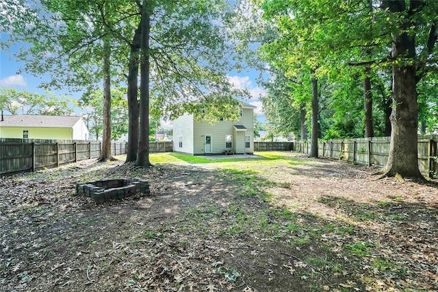 2100 Ruth St, Chesapeake, VA 23324 - fenced backyard featuring a fire pit