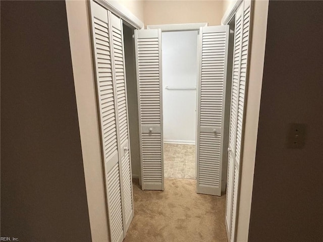 hall featuring carpet floors