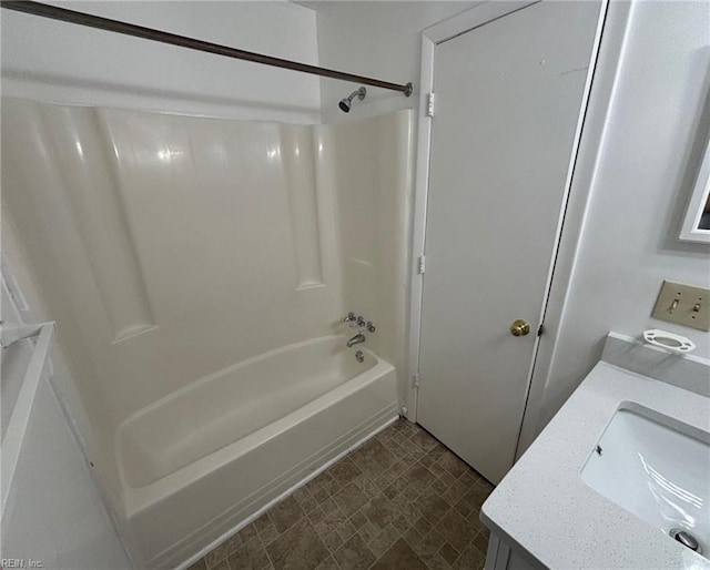 bathroom featuring vanity, shower / bathing tub combination, and tile patterned floors