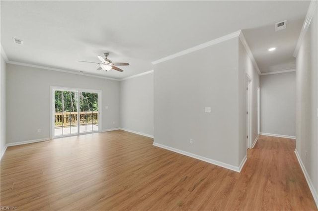 unfurnished room with visible vents, crown molding, baseboards, ceiling fan, and light wood-style flooring