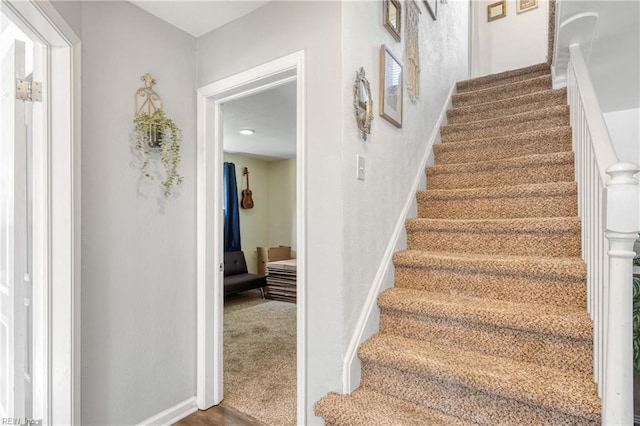 stairs featuring baseboards