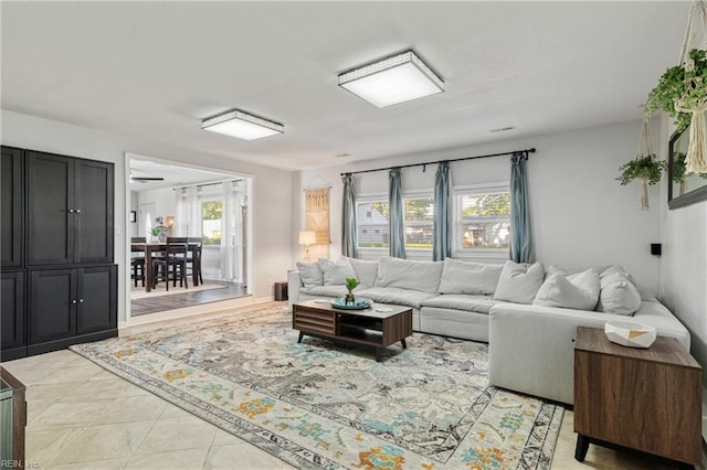 living area with light tile patterned floors