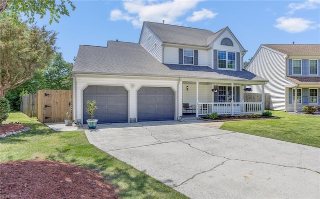traditional home with fence, a front lawn, a garage, covered porch, and driveway