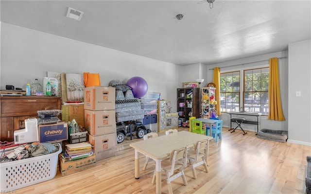 rec room with visible vents and wood finished floors