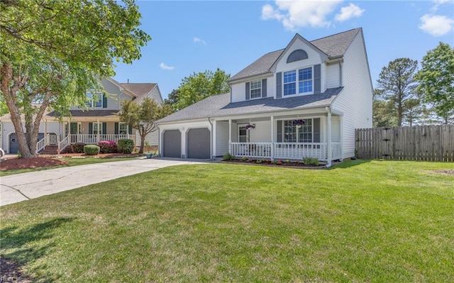 traditional home with a porch, a garage, fence, and concrete driveway