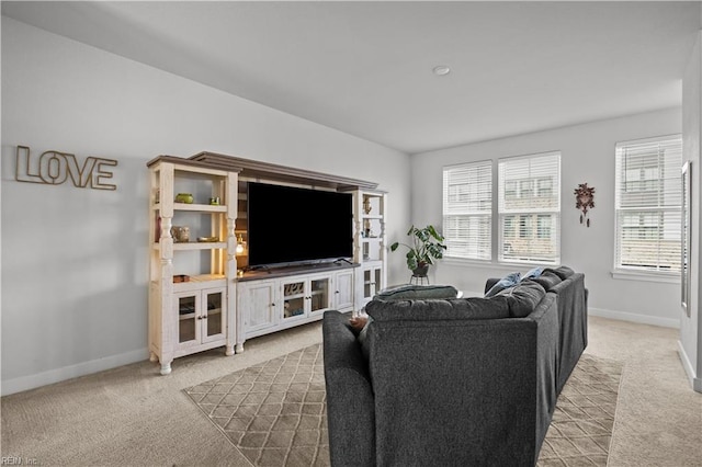 carpeted living room with baseboards