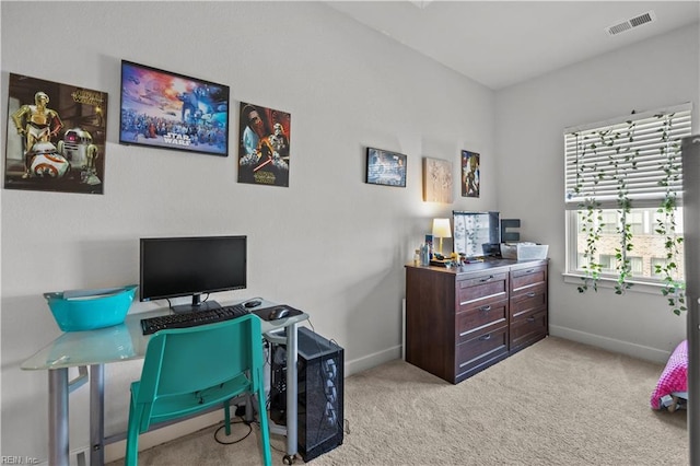 home office featuring baseboards, light carpet, and visible vents