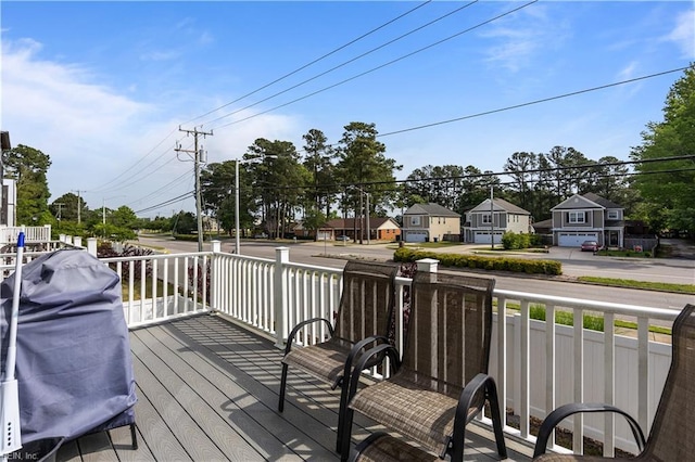 wooden deck featuring a residential view
