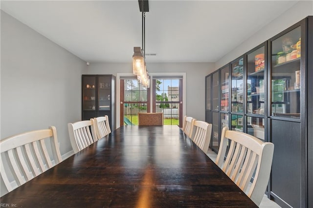 dining space featuring a notable chandelier