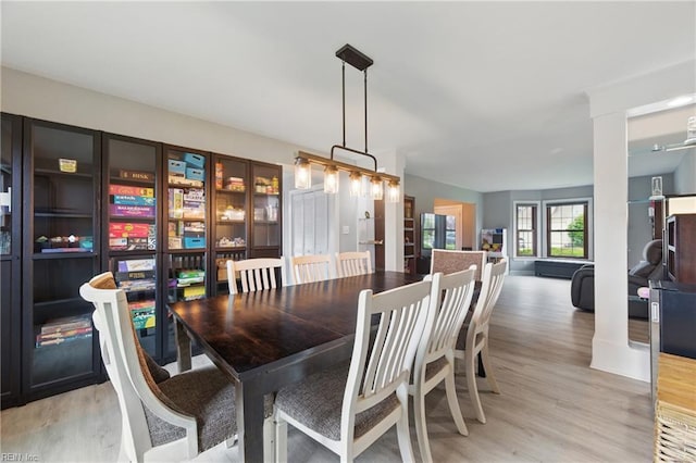 dining space featuring light wood finished floors