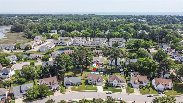 drone / aerial view with a residential view and a water view