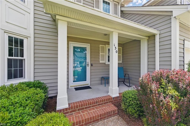doorway to property featuring a porch