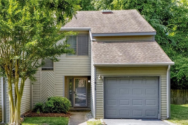 1615 Colonnade Cres, Virginia Beach, VA 23451 - view of front of property with a shingled roof, a garage, fence, and driveway