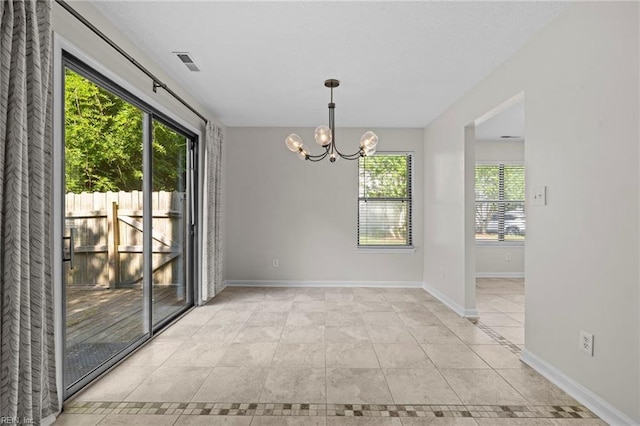 1615 Colonnade Cres, Virginia Beach, VA 23451 - unfurnished dining area featuring healthy amount of natural light, a chandelier, and baseboards