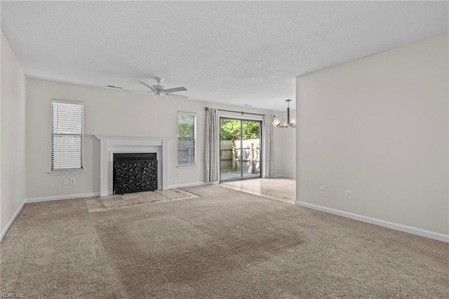 1615 Colonnade Cres, Virginia Beach, VA 23451 - unfurnished living room with ceiling fan, a chandelier, a fireplace with flush hearth, carpet floors, and baseboards