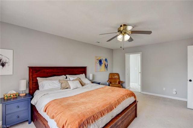 bedroom with baseboards, ceiling fan, light carpet, and visible vents