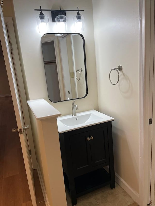 bathroom featuring baseboards and vanity