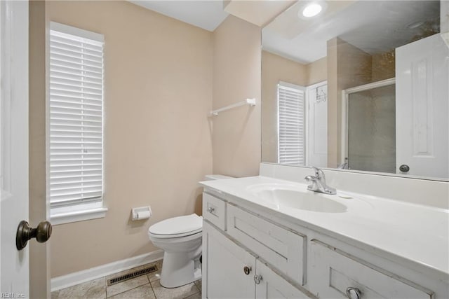 bathroom featuring visible vents, tile patterned flooring, a shower stall, vanity, and baseboards