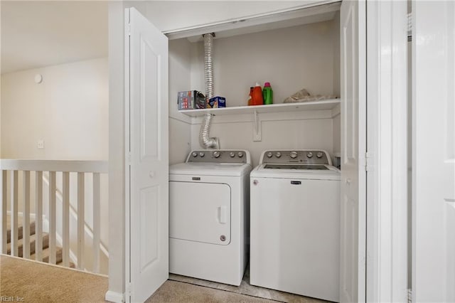 laundry area featuring separate washer and dryer and laundry area