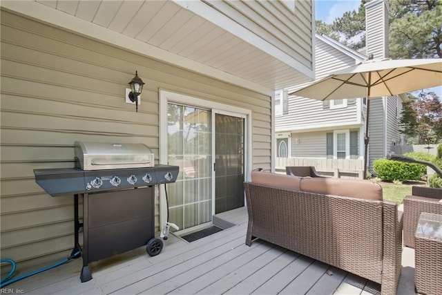wooden deck featuring outdoor lounge area and grilling area