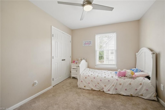 carpeted bedroom with baseboards and ceiling fan