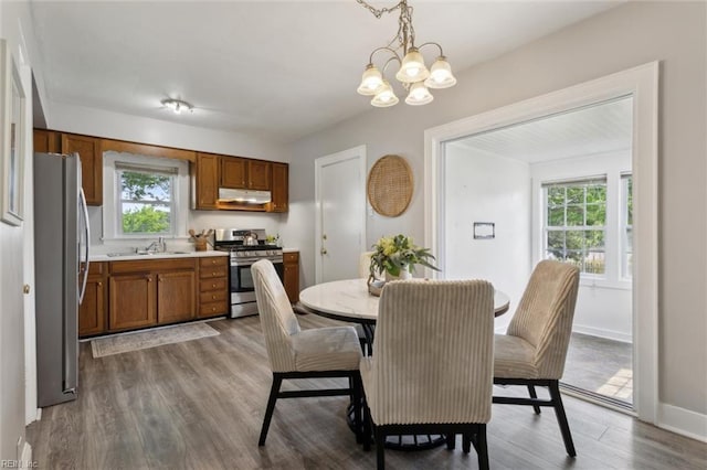 1312 E Norcova Dr, Norfolk, VA 23502 - dining space with baseboards, a notable chandelier, plenty of natural light, and wood finished floors
