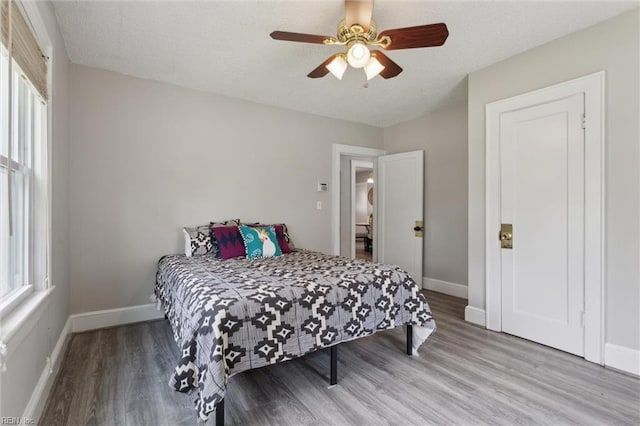 1312 E Norcova Dr, Norfolk, VA 23502 - bedroom featuring baseboards, multiple windows, and wood finished floors