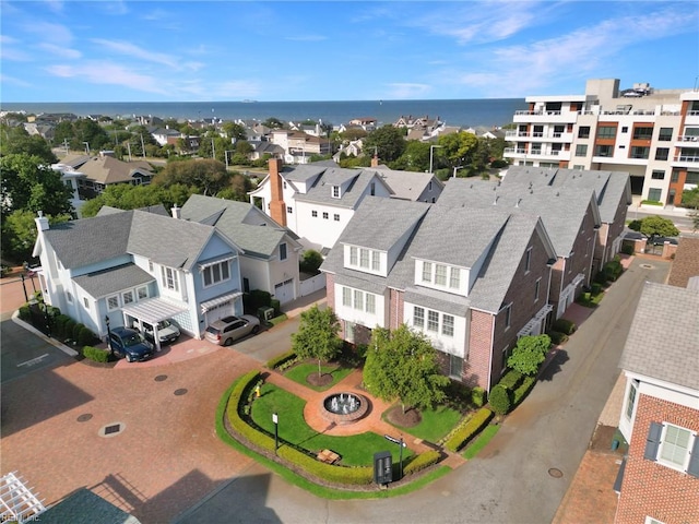 aerial view with a water view and a residential view