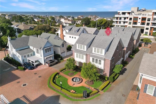 aerial view with a water view and a residential view