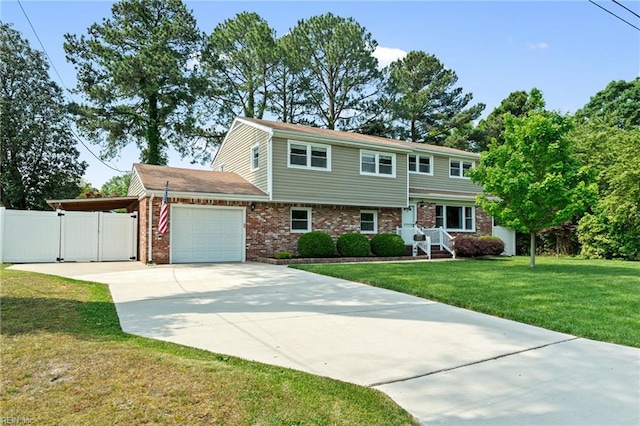 5013 Finn Rd, Virginia Beach, VA 23455 - view of front of home featuring fence, brick siding, a garage, a gate, and driveway