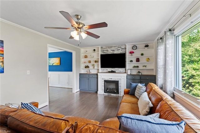5013 Finn Rd, Virginia Beach, VA 23455 - living room featuring crown molding, built in features, ceiling fan, a large fireplace, and dark wood finished floors