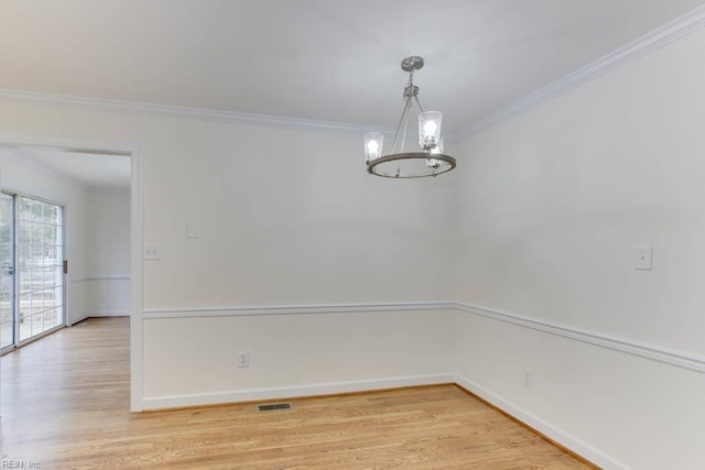 106 Running Man Trl, Yorktown, VA 23693 - unfurnished dining area featuring crown molding, light wood finished floors, and a notable chandelier