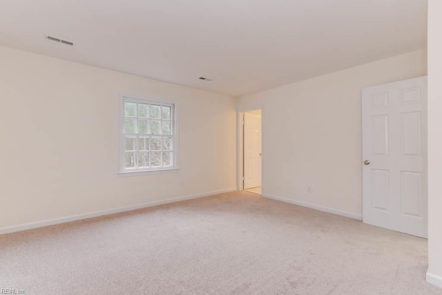 106 Running Man Trl, Yorktown, VA 23693 - spare room featuring baseboards, light colored carpet, and visible vents