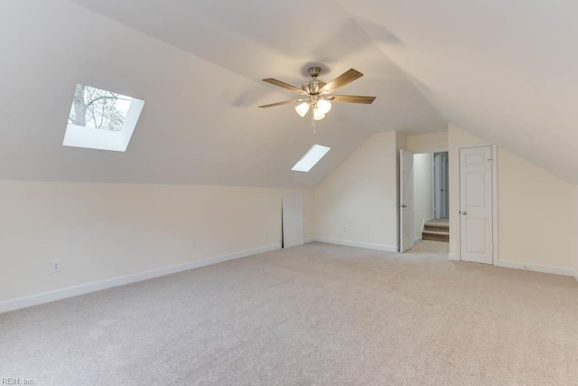 106 Running Man Trl, Yorktown, VA 23693 - additional living space featuring a ceiling fan, baseboards, light carpet, and lofted ceiling with skylight