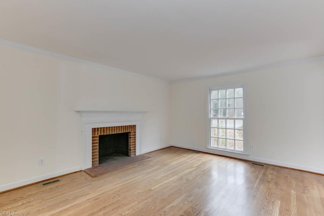 106 Running Man Trl, Yorktown, VA 23693 - unfurnished living room with crown molding, baseboards, wood finished floors, and a fireplace