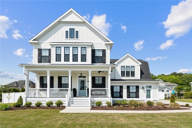 2245 Chamberino Dr, Virginia Beach, VA 23456 - modern farmhouse style home featuring a porch, board and batten siding, fence, and a front yard