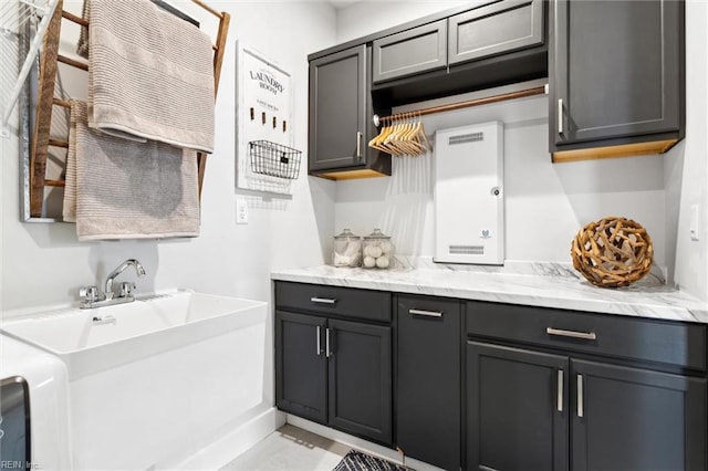 2245 Chamberino Dr, Virginia Beach, VA 23456 - interior space with gray cabinetry and light stone counters