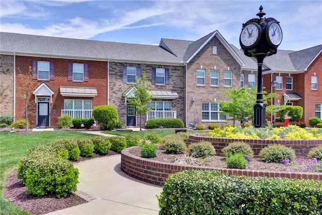 view of front of home with brick siding