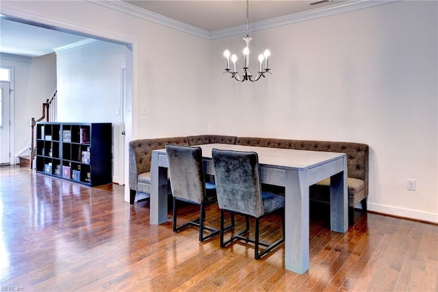 4217 Greenview Aly, Williamsburg, VA 23188 - dining area featuring an inviting chandelier, ornamental molding, stairs, and wood finished floors