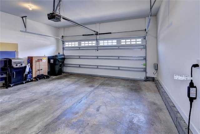 4217 Greenview Aly, Williamsburg, VA 23188 - garage featuring baseboards and a garage door opener